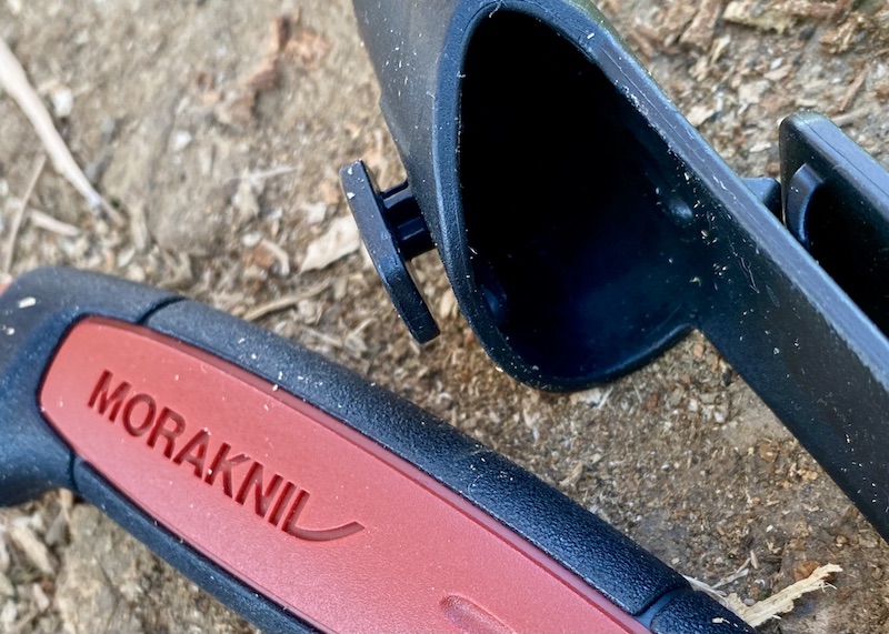 The indentation on the handle is how the Morakniv sheath locks to the knife. It provides a positive (and satisfying) click.