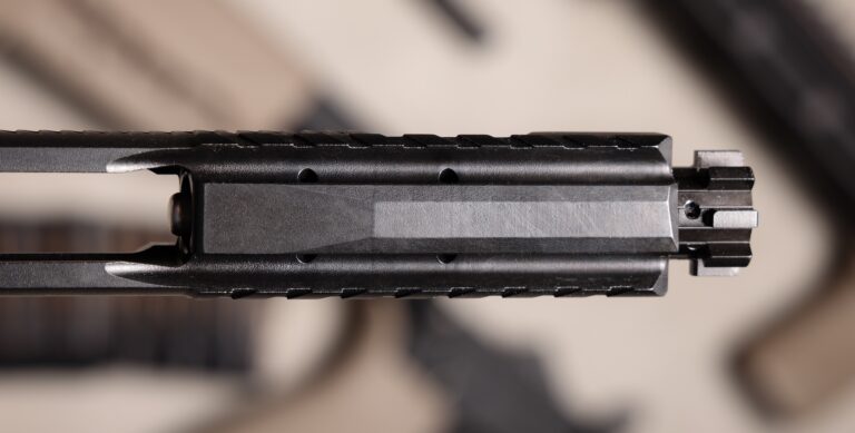 The KAK Industry K-SPEC BCG has downward gas vents to help reduce the amount of debris thrown into the shooters face. 