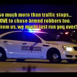 Police Car with Lights on parked with a caption written above it