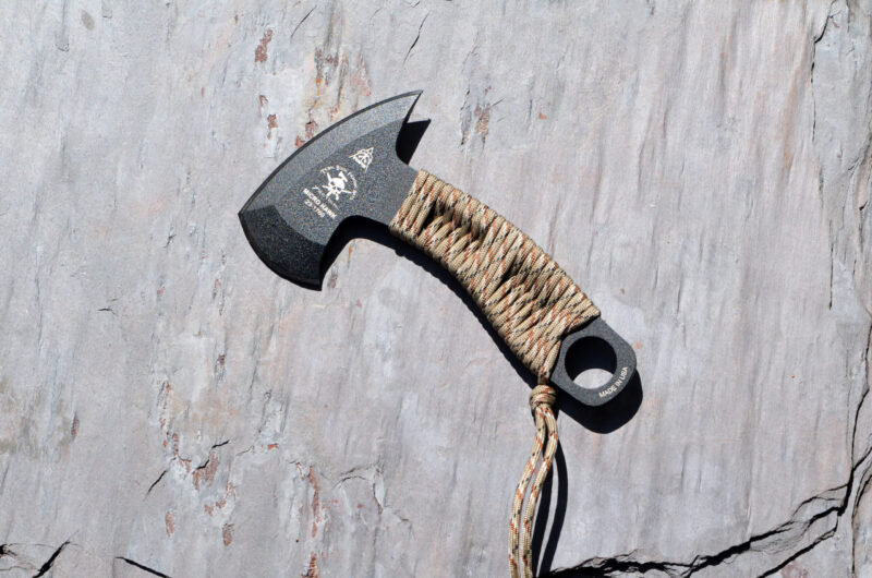 TOPS Microhawk sitting against a grey wood background