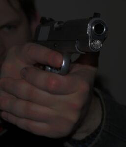 Picture of a person holding a pistol in a defensive position