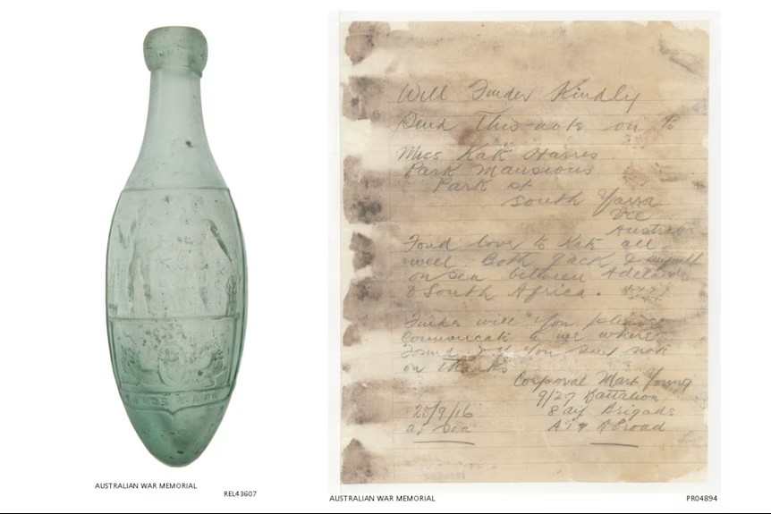 An old, tear dropped shaped soda bottle, and an old damaged hand written letter