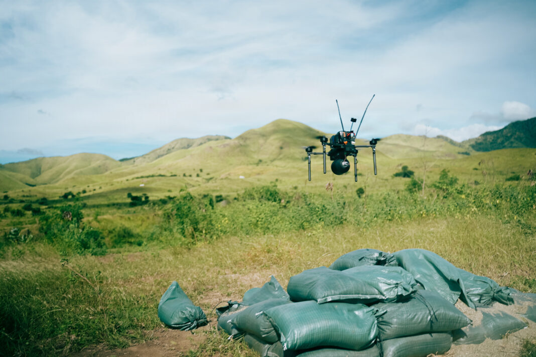 A U.S. Marine with Battalion Landing Team 3/6, 22nd Marine Expeditionary Unit (Special Operations Capable), launches a Neros Archer first-person view drone during an attack drone training final exercise on Camp Santiago, Puerto Rico, Nov. 25, 2025. 22nd MEU(SOC) Marines are being trained and certified by 2nd Marine Division and the Marine Corps Attack Drone Team on first-person view drone systems to enhance combat readiness. U.S. military forces are deployed to the Caribbean in support of the U.S. Southern Command mission, Department of War-directed operations, and the president's priorities to disrupt illicit drug trafficking and protect the homeland. (U.S. Marine Corps photo)