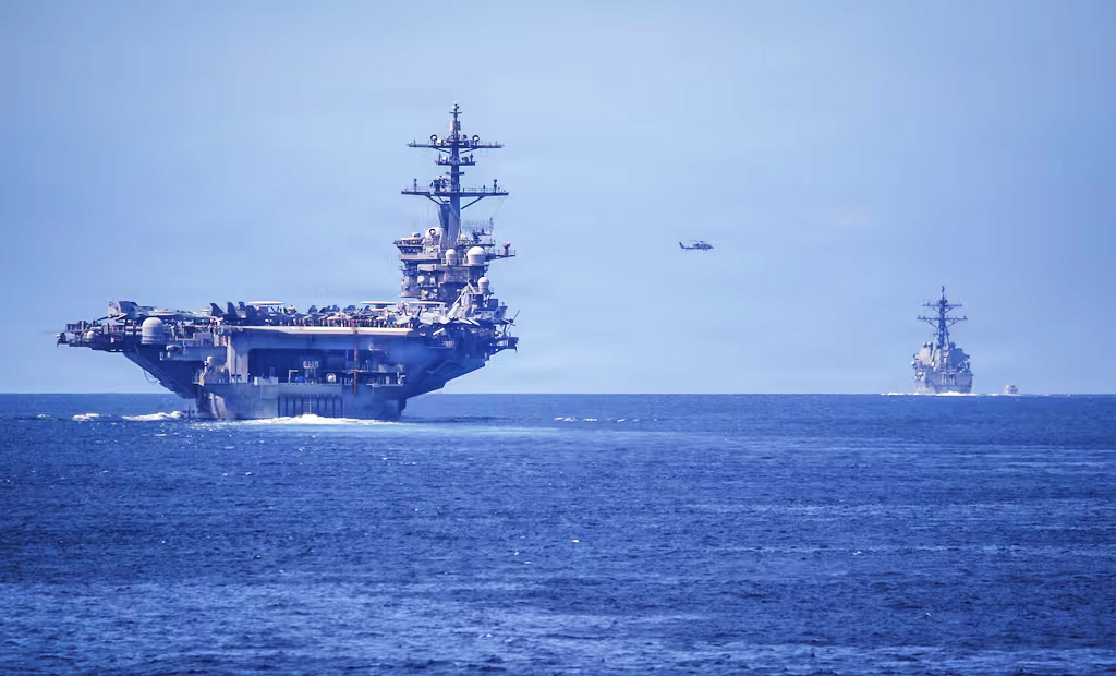 US aircraft carrier USS Abraham Lincoln and one of her escorts, the USS Spruance, enforcing the Strait of Hormuz blockade